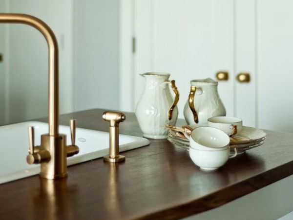 Brass fixtures in kitchen